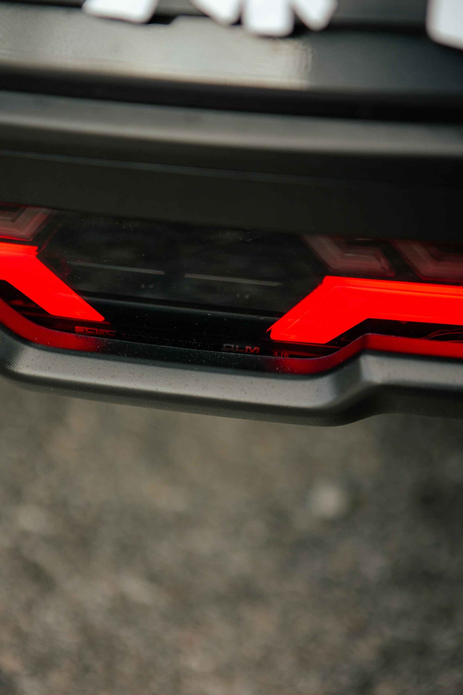OLM V2 F1 Rear Fog Light (Clear Lens, Black Base, Red Bar) - 2022 BRZ / GR86