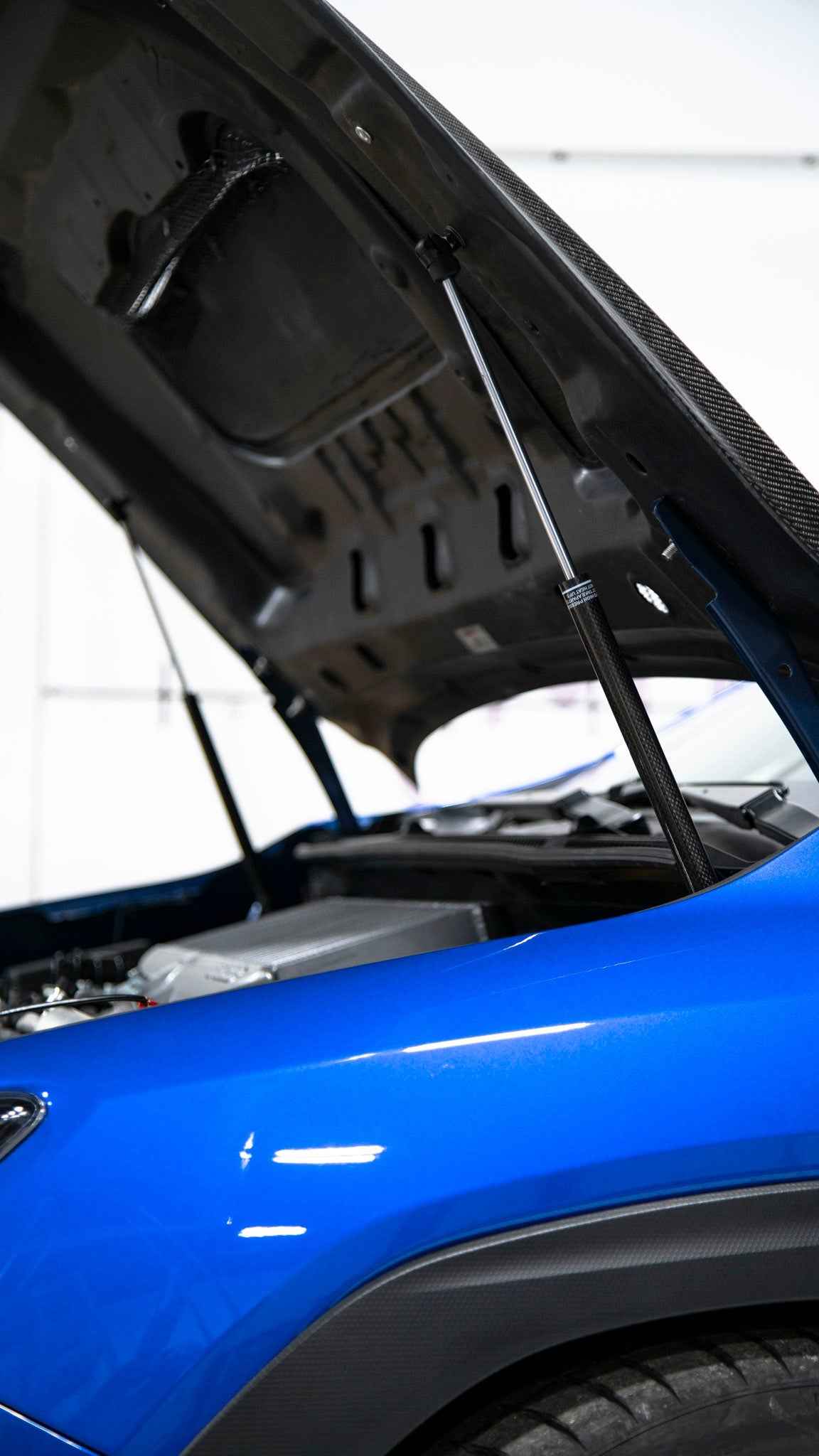 OLM Carbon Fiber Wrapped Hood Struts - 2022+ WRX