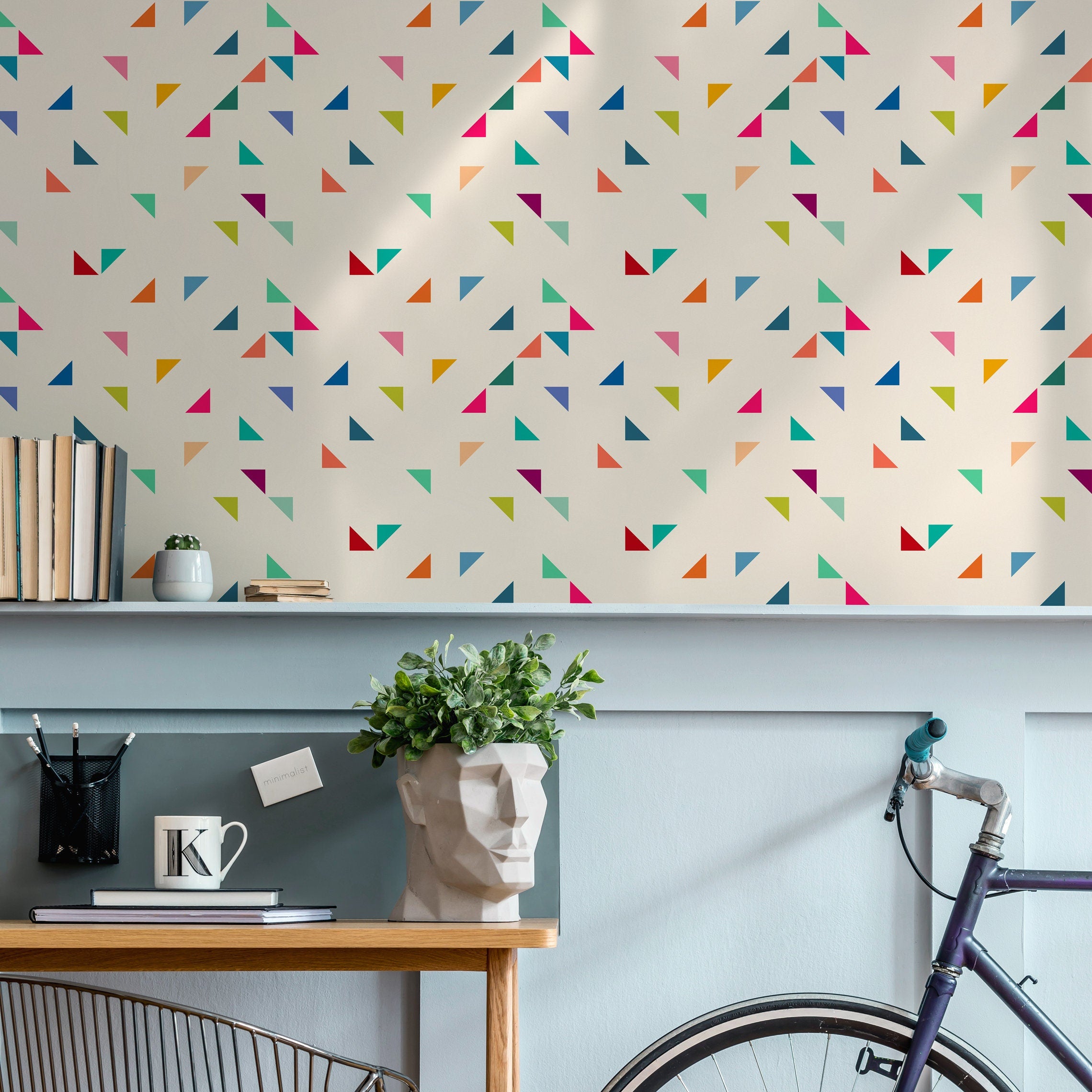 Geometric Wallpaper with Colorful Scattered Triangles in Blue, Pink, and Green - B292