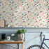 Geometric Wallpaper with Colorful Scattered Triangles in Blue, Pink, and Green - B292
